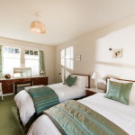 double bedroom with large windows