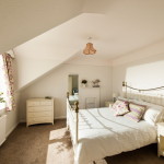 white bedroom with large window